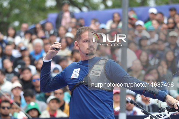 Marcus D'Almeida of Brazil competes against Lee Woo-Seok of Korea (not in picture) during the Men's recurve semifinals match on the final da...