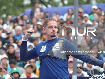 Marcus D'Almeida of Brazil competes against Lee Woo-Seok of Korea (not in picture) during the Men's recurve semifinals match on the final da...