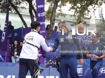 Lee Woo-Seok of Korea and Marcus D'Almeida of Brazil compete during the Men's recurve semifinals match on the final day of the Tlaxcala 2024...