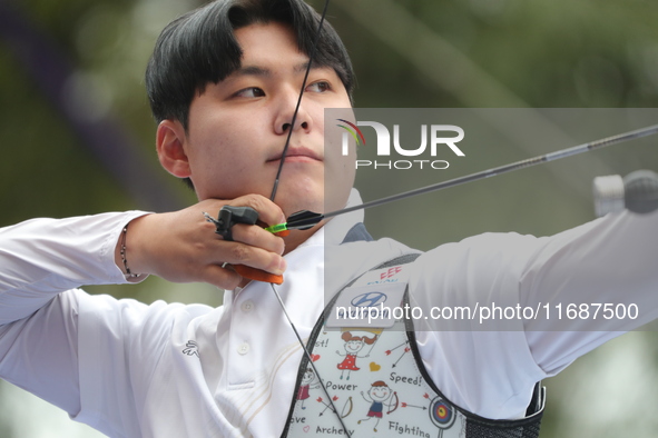 Lee Woo-Seok of Korea competes against Marcus D'Almeida of Brazil (not in picture) during the Men's recurve semifinals match on the final da...