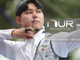 Lee Woo-Seok of Korea competes against Marcus D'Almeida of Brazil (not in picture) during the Men's recurve semifinals match on the final da...