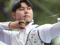 Lee Woo-Seok of Korea competes against Marcus D'Almeida of Brazil (not in picture) during the Men's recurve semifinals match on the final da...