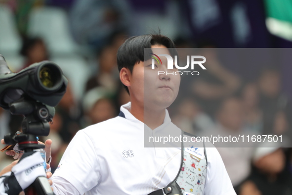 Lee Woo-Seok of Korea competes against Marcus D'Almeida of Brazil (not in picture) during the Men's recurve semifinals match on the final da...