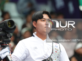 Lee Woo-Seok of Korea competes against Marcus D'Almeida of Brazil (not in picture) during the Men's recurve semifinals match on the final da...