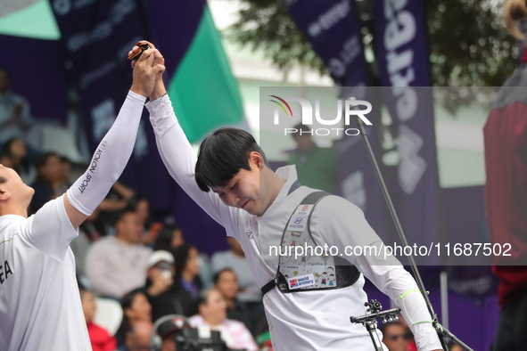 Lee Woo-Seok of Korea competes against Marcus D'Almeida of Brazil (not in picture) during the Men's recurve semifinals match on the final da...