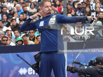 Marcus D'Almeida of Brazil competes against Lee Woo-Seok of Korea (not in picture) during the Men's recurve semifinals match on the final da...