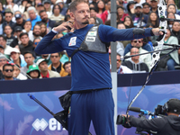 Marcus D'Almeida of Brazil competes against Lee Woo-Seok of Korea (not in picture) during the Men's recurve semifinals match on the final da...