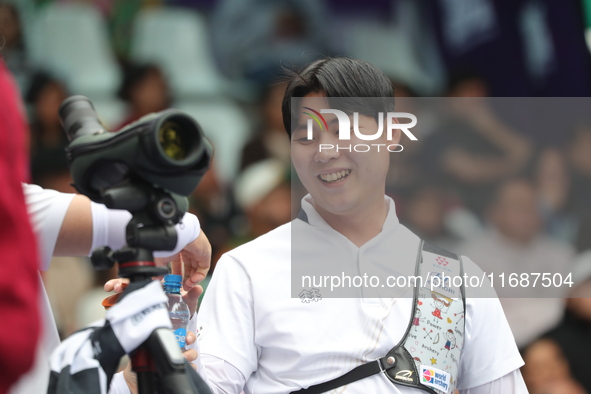 Lee Woo-Seok of Korea competes against Marcus D'Almeida of Brazil (not in picture) during the Men's recurve semifinals match on the final da...