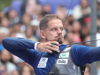 Marcus D'Almeida of Brazil competes against Lee Woo-Seok of Korea (not in picture) during the Men's recurve semifinals match on the final da...