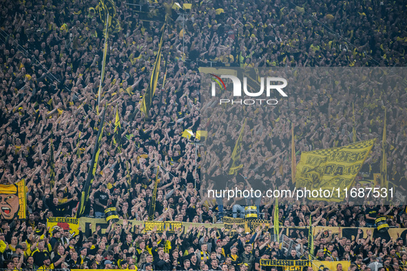 Fans of Borussia Dortmund cheer for their team prior to the Bundesliga match between Borussia Dortmund and FC St. Pauli 1910 at Signal Iduna...