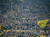 Fans of Borussia Dortmund cheer for their team prior to the Bundesliga match between Borussia Dortmund and FC St. Pauli 1910 at Signal Iduna...