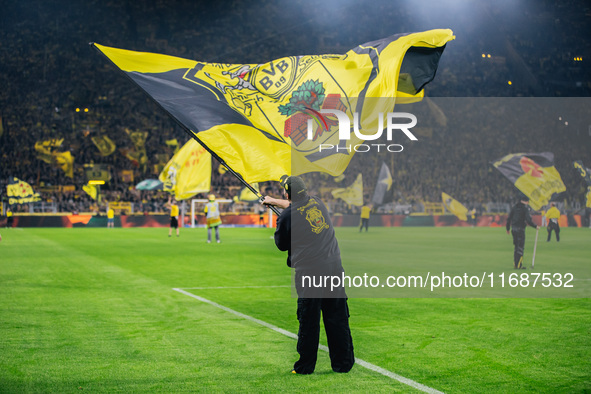 Fans of Borussia Dortmund cheer for their team prior to the Bundesliga match between Borussia Dortmund and FC St. Pauli 1910 at Signal Iduna...