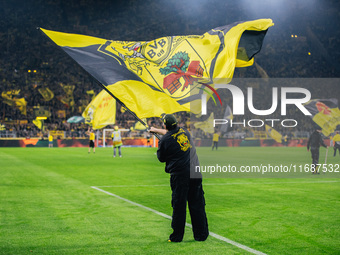 Fans of Borussia Dortmund cheer for their team prior to the Bundesliga match between Borussia Dortmund and FC St. Pauli 1910 at Signal Iduna...