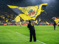 Fans of Borussia Dortmund cheer for their team prior to the Bundesliga match between Borussia Dortmund and FC St. Pauli 1910 at Signal Iduna...