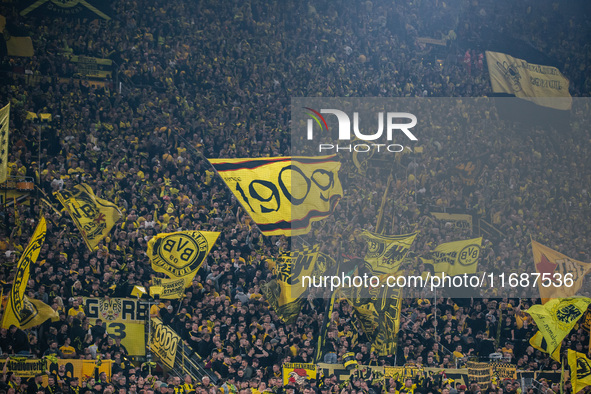 Fans of Borussia Dortmund cheer for their team prior to the Bundesliga match between Borussia Dortmund and FC St. Pauli 1910 at Signal Iduna...