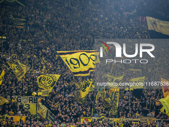 Fans of Borussia Dortmund cheer for their team prior to the Bundesliga match between Borussia Dortmund and FC St. Pauli 1910 at Signal Iduna...