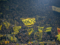 Fans of Borussia Dortmund cheer for their team prior to the Bundesliga match between Borussia Dortmund and FC St. Pauli 1910 at Signal Iduna...