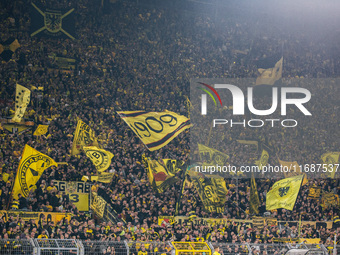 Fans of Borussia Dortmund cheer for their team prior to the Bundesliga match between Borussia Dortmund and FC St. Pauli 1910 at Signal Iduna...