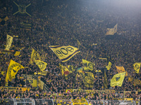 Fans of Borussia Dortmund cheer for their team prior to the Bundesliga match between Borussia Dortmund and FC St. Pauli 1910 at Signal Iduna...