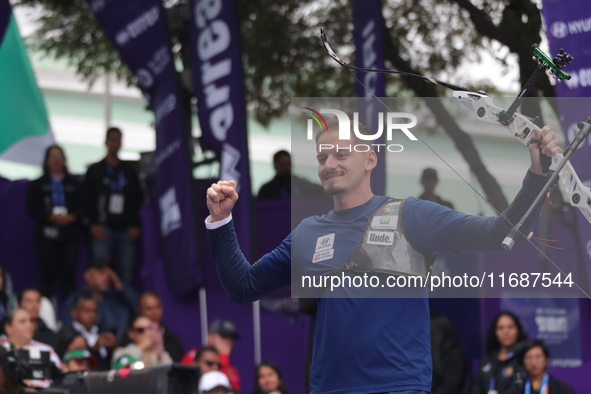 Marcus D'Almeida of Brazil competes against Matias Grande of Mexico (not in picture) during the Men's recurve 3rd place match on the final d...