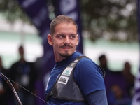 Marcus D'Almeida of Brazil competes against Matias Grande of Mexico (not in picture) during the Men's recurve 3rd place match on the final d...