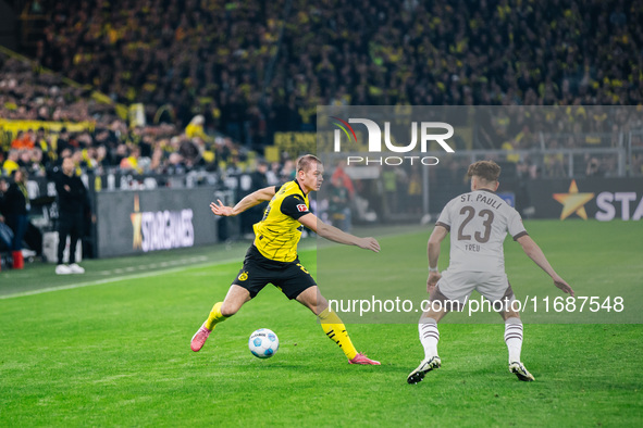 Julian Ryerson of Borussia Dortmund plays the ball during the Bundesliga match between Borussia Dortmund and FC St. Pauli 1910 at Signal Idu...