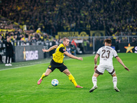 Julian Ryerson of Borussia Dortmund plays the ball during the Bundesliga match between Borussia Dortmund and FC St. Pauli 1910 at Signal Idu...