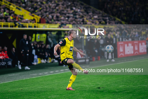 Julian Ryerson of Borussia Dortmund plays the ball during the Bundesliga match between Borussia Dortmund and FC St. Pauli 1910 at Signal Idu...