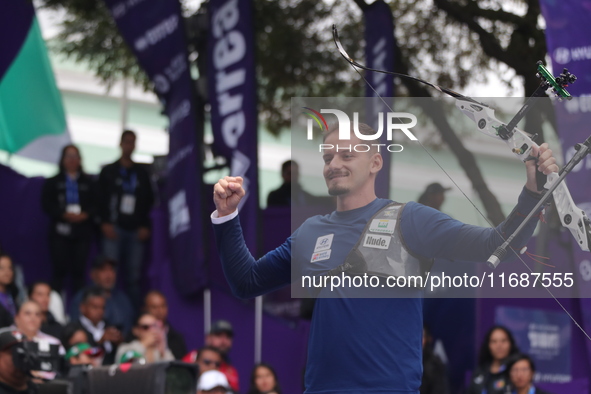 Marcus D'Almeida of Brazil competes against Matias Grande of Mexico (not in picture) during the Men's recurve 3rd place match on the final d...