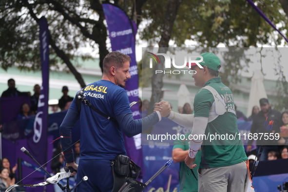 Marcus D'Almeida of Brazil and Matias Grande of Mexico compete during the Men's recurve 3rd place match on the final day of the Tlaxcala 202...