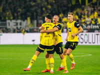 Ramy Bensebaini of Borussia Dortmund celebrates his goal with teammates during the Bundesliga match between Borussia Dortmund and FC St. Pau...