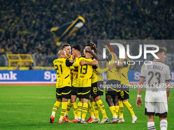 Players of Borussia Dortmund celebrate after scoring the first goal during the Bundesliga match between Borussia Dortmund and FC St. Pauli 1...