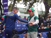 Marcus D'Almeida of Brazil and Matias Grande of Mexico compete during the Men's recurve 3rd place match on the final day of the Tlaxcala 202...