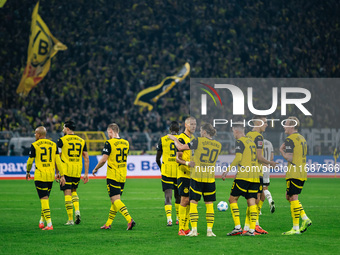 Players of Borussia Dortmund celebrate after scoring the first goal during the Bundesliga match between Borussia Dortmund and FC St. Pauli 1...