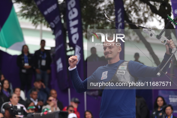 Marcus D'Almeida of Brazil competes against Matias Grande of Mexico (not in picture) during the Men's recurve 3rd place match on the final d...