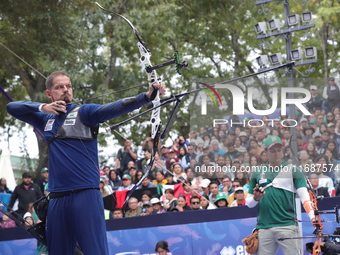 Marcus D'Almeida of Brazil and Matias Grande of Mexico compete during the Men's recurve 3rd place match on the final day of the Tlaxcala 202...