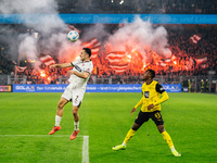 Jamie Bynoe-Gittens of Borussia Dortmund plays against Manolis Saliakas of FC St. Pauli during the Bundesliga match between Borussia Dortmun...