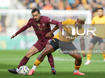 Mario Lemina of Wolves and Bernardo Silva of Manchester City are in action during the Premier League match between Wolverhampton Wanderers a...