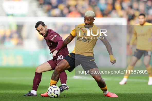 Mario Lemina of Wolves and Bernardo Silva of Manchester City are in action during the Premier League match between Wolverhampton Wanderers a...