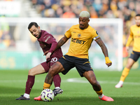 Mario Lemina of Wolves and Bernardo Silva of Manchester City are in action during the Premier League match between Wolverhampton Wanderers a...