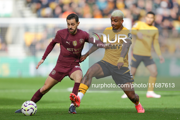 Mario Lemina of Wolves and Bernardo Silva of Manchester City are in action during the Premier League match between Wolverhampton Wanderers a...