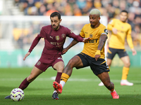 Mario Lemina of Wolves and Bernardo Silva of Manchester City are in action during the Premier League match between Wolverhampton Wanderers a...