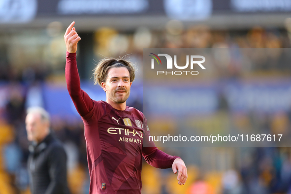 Jack Grealish of Manchester City salutes the fans after the Premier League match between Wolverhampton Wanderers and Manchester City at Moli...