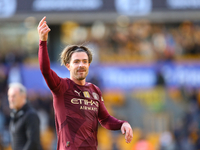 Jack Grealish of Manchester City salutes the fans after the Premier League match between Wolverhampton Wanderers and Manchester City at Moli...