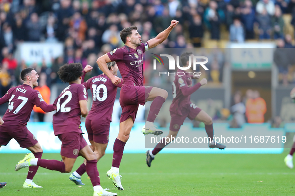 Manchester City's players celebrate after their second goal, scored by John Stones, is confirmed by VAR during the Premier League match betw...