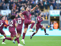 Manchester City's players celebrate after their second goal, scored by John Stones, is confirmed by VAR during the Premier League match betw...