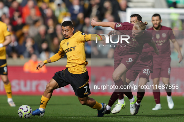 Andre of Wolves battles for possession with Erling Haaland of Manchester City during the Premier League match between Wolverhampton Wanderer...