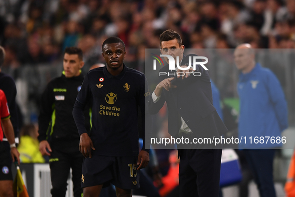 Juventus' head coach Thiago Motta talks with Juventus' Pierre Kalulu during the Serie A match between Juventus FC and SS Lazio at Allianz St...