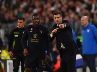 Juventus' head coach Thiago Motta talks with Juventus' Pierre Kalulu during the Serie A match between Juventus FC and SS Lazio at Allianz St...