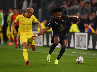 Lazio's Gustav Isaksen battles for the ball with Juventus' Khephren Thuram during the Serie A match between Juventus FC and SS Lazio at Alli...